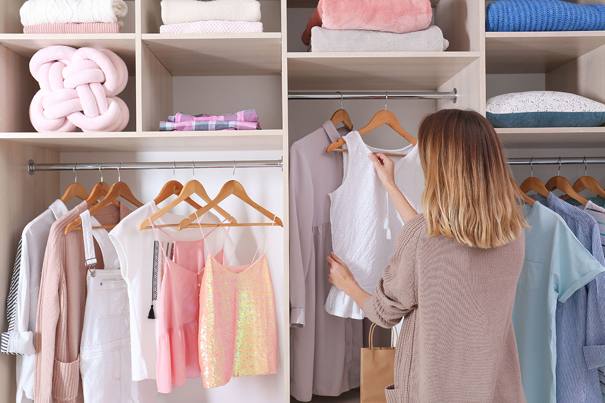 woman-organizing-closet